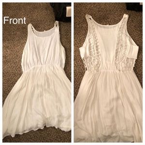 Off-white dress with cut out back
